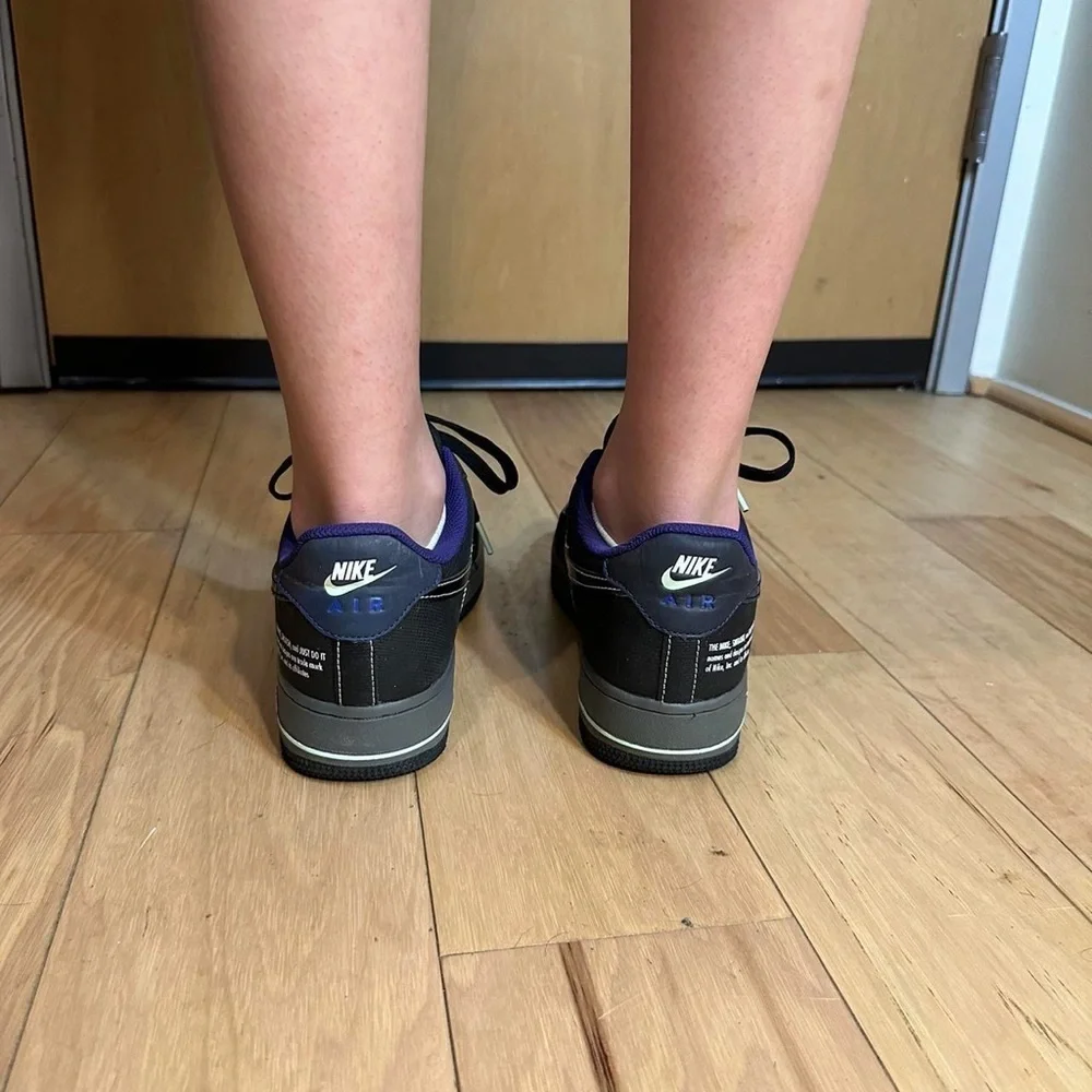 Nike Black and Purple Glow in the dark black AF1s Sneakers.